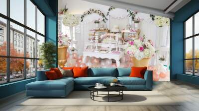 table with sweets decorated for children party reception Wall mural