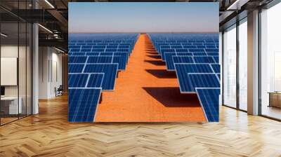 A vast solar panel field under a clear blue sky, showcasing renewable energy technology. Wall mural