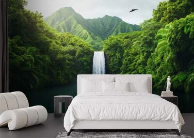 Lush green foliage surrounds a cascading waterfall in a tropical rainforest. Wall mural