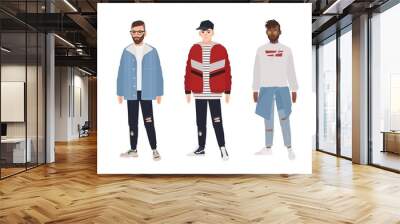 Collection of young men dressed in fashionable clothes isolated on white background. Set of guys wearing trendy apparel. Bundle of street style outfits. Flat cartoon colored vector illustration. Wall mural