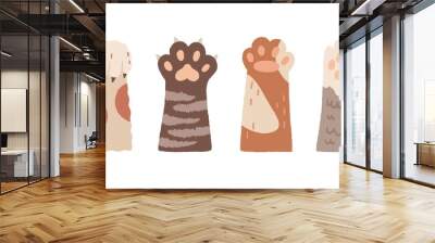 Cute cat paws with claws and soft pads. Set of funny raised up foot of kittens. Sweet kitties giving high five. Colored flat vector illustration of kawaii animal palms isolated on white background Wall mural