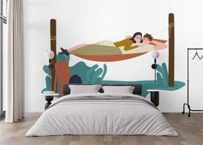 Funny young man and woman lying together in hummock Wall mural