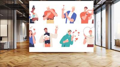 Set of people giving and sharing love, donating. Concept of assistance, care, philanthropy and support. Men and women holding hearts. Colored flat vector illustration isolated on white background Wall mural