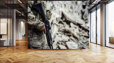 Close-up of a soldier holding a rifle in rubble Wall mural