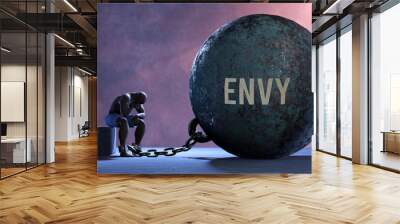 Envy that limits life and make suffer, imprisoning in painful condition. It is a burden that keeps a person enslaved in misery.,3d illustration Wall mural