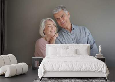  Lovely portrait of attractive senior couple on grey background Wall mural