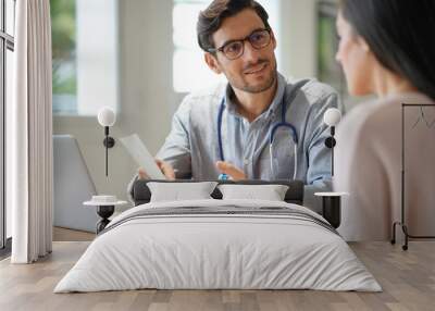  Modern young doctor speaking to patient in office Wall mural