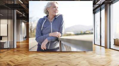  Portrait of attractive senior woman in sportswear outdoors Wall mural