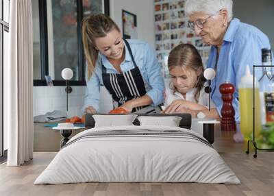 3-generation-family cooking together Wall mural