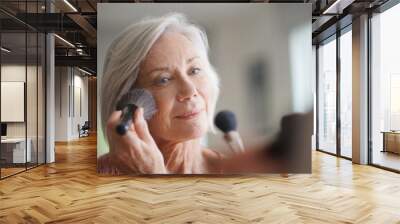 Beautiful elderly woman applying make up Wall mural