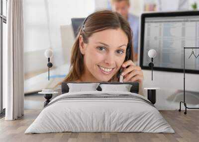 Beautiful smiling teleoperator with headset on Wall mural