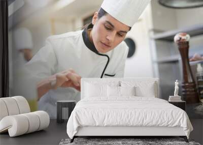 closeup of cook chef in professional kitchen preparing dish Wall mural