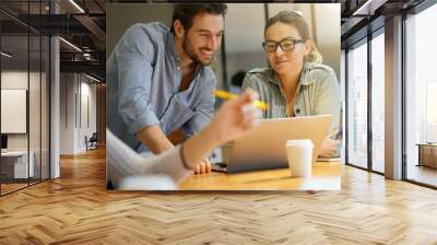 colleagues workshopping business ideas in modern co working space Wall mural