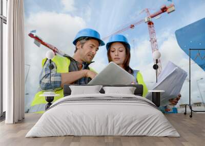 construction manager and engineer working on building site Wall mural