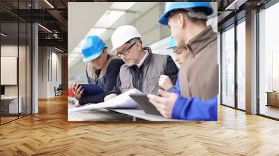 Construction manager giving instructions to training students Wall mural