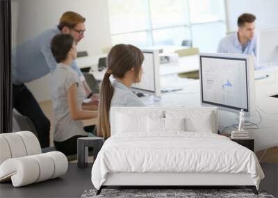 Creative people working in office on computer Wall mural