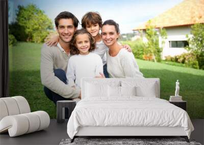 Cute family portrait of 4 people Wall mural