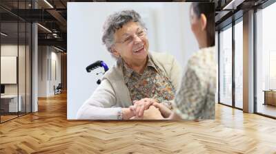 elderly woman sharing good time with home carer Wall mural