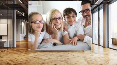 Family of four wearing eyeglasses Wall mural