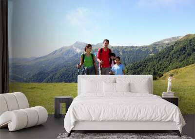 Family on a trekking day in the mountains Wall mural