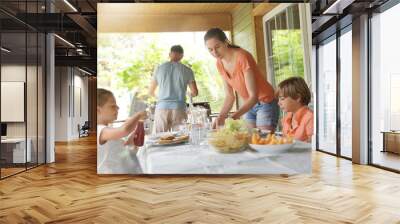 Family on vacation having outdoor lunch Wall mural