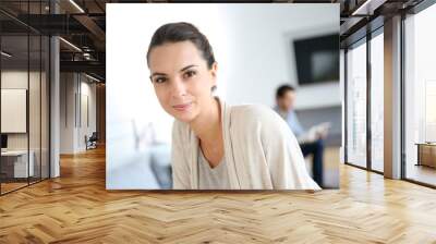 Gorgeous woman at home relaxing in living-room Wall mural