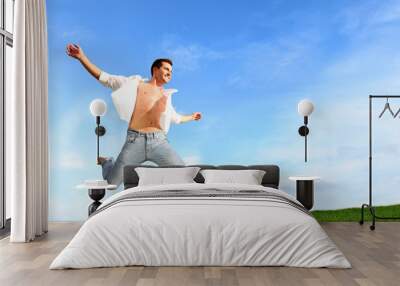 Man jumping in the air with joy Wall mural