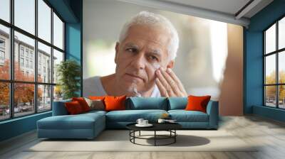 mature man in front of mirror using cosmetics Wall mural