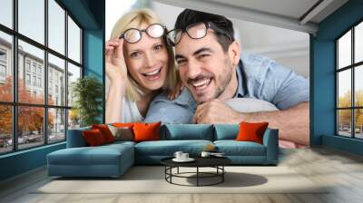 Middle-aged couple wearing eyeglasses Wall mural