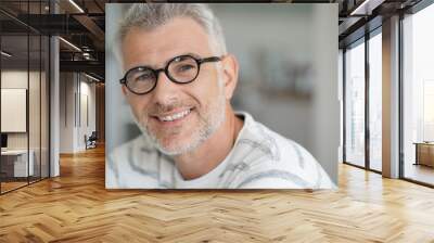 Middle-aged guy with trendy eyeglasses Wall mural