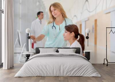 nurse with intern working in front of computer Wall mural