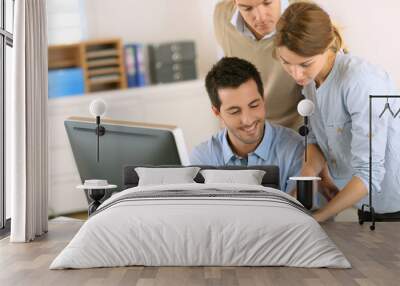 Office workers using tablet and computer Wall mural