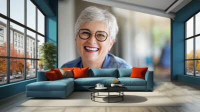 portrait of a beautiful smiling 55 year old woman with white hair Wall mural