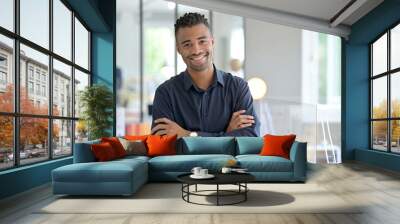 Portrait of african american businessman in co-working office Wall mural