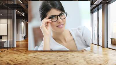 Portrait of beautiful young woman with eyeglasses on Wall mural