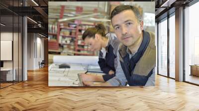 Portrait of carpenter working in workshop Wall mural