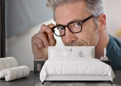 Portrait of handsome mature man with eyeglasses Wall mural