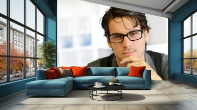 Portrait of handsome young man with glasses Wall mural