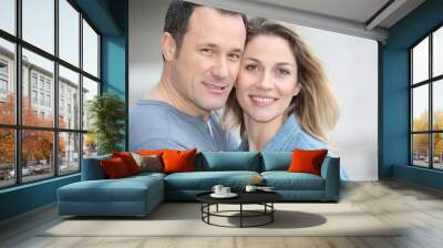 Portrait of happy couple standing outdoors Wall mural