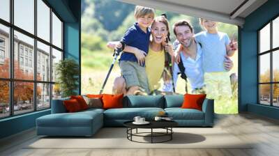 portrait of happy family on a hiking day in the mountain Wall mural