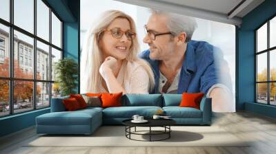 Portrait of happy middle-aged couple with eyeglasses Wall mural