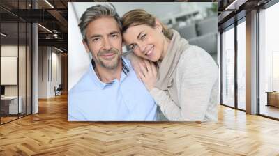 Portrait of mature couple relaxing at home Wall mural