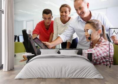 Teacher with students in computing class Wall mural