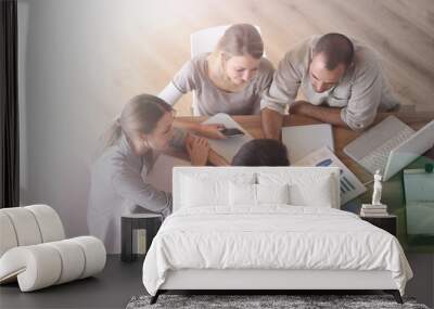 Upper view of business people around table Wall mural