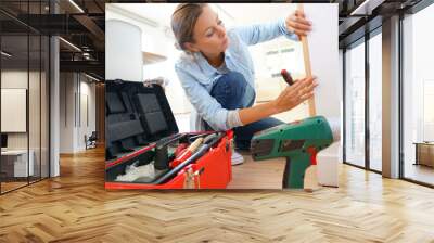 Woman doing DIY work at home Wall mural