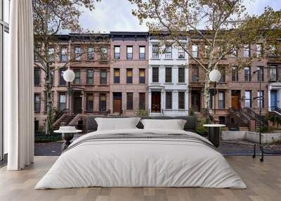 a view of a row of historic brownstone buildings in an iconic neighborhood of Manhattan, New York City Wall mural