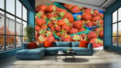 Organic Norwegian strawberies in a paper box. Fresh berries just picked up in the strawberry field in a countryside ready for healthy snacks and desserts. Wall mural