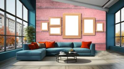 Collage of blank brown wooden frames , interior decor mock up on old pink wooden wall, vintage style Wall mural