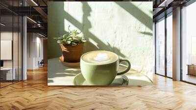 Hot Matcha Latte drink in modern off-white minimalist trendy stylish vegan plant-based cafe bar setting with stucco concrete wall, product photography, outdoors, sunny, beverage, bright Wall mural