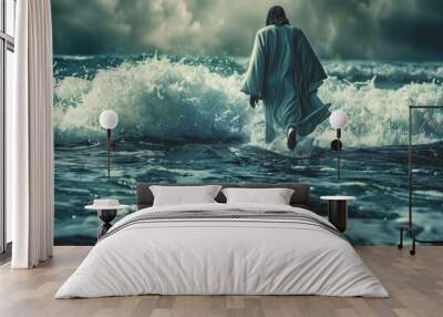 A solitary figure walks across the stormy sea, a testament to faith and divine power. Wall mural